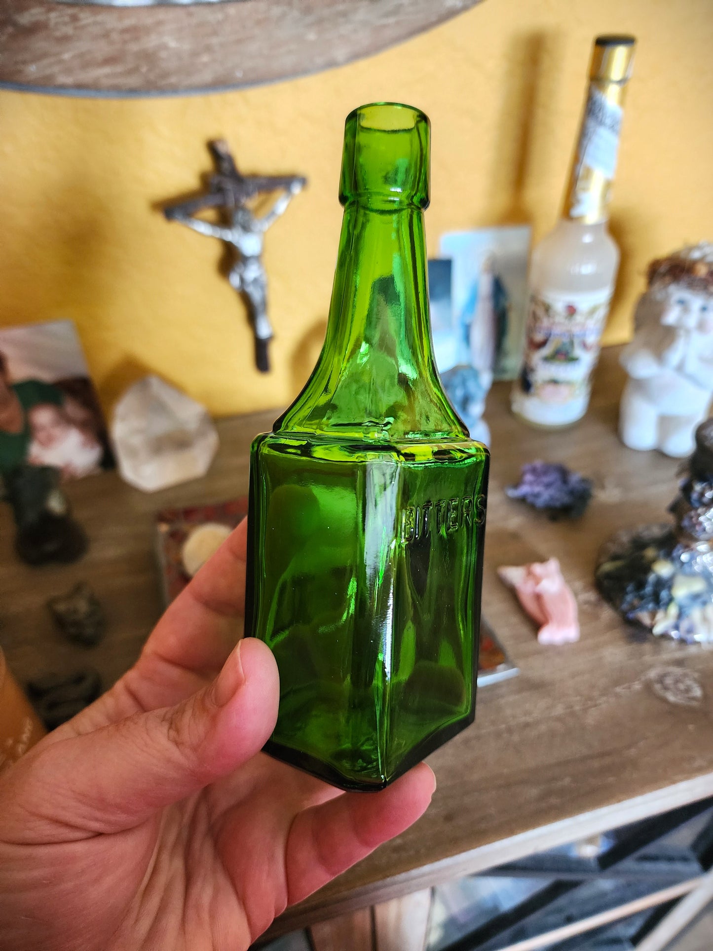 Vintage green glass bitters bottle