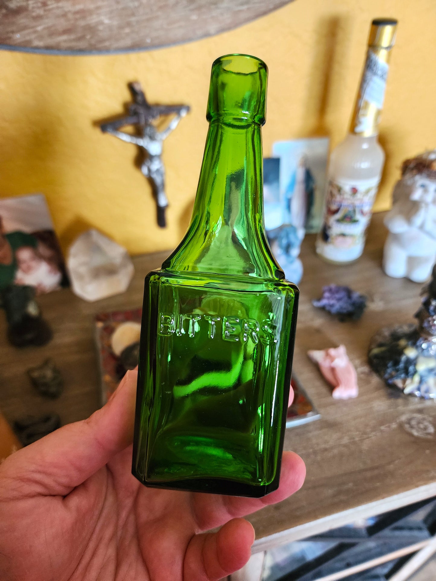 Vintage green glass bitters bottle